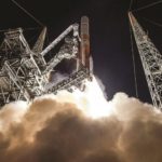 a rocket is being launched into the sky