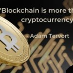 a man with a beard standing next to a bitcoin