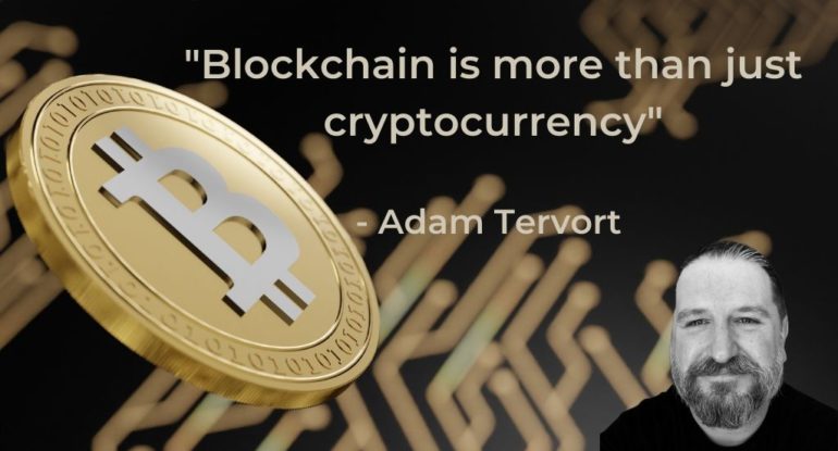 a man with a beard standing next to a bitcoin