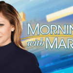 a woman in a black top is posing for a picture