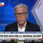 a man in glasses is on the news