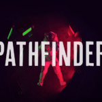 a person standing in front of a dark background with the words pathfinder