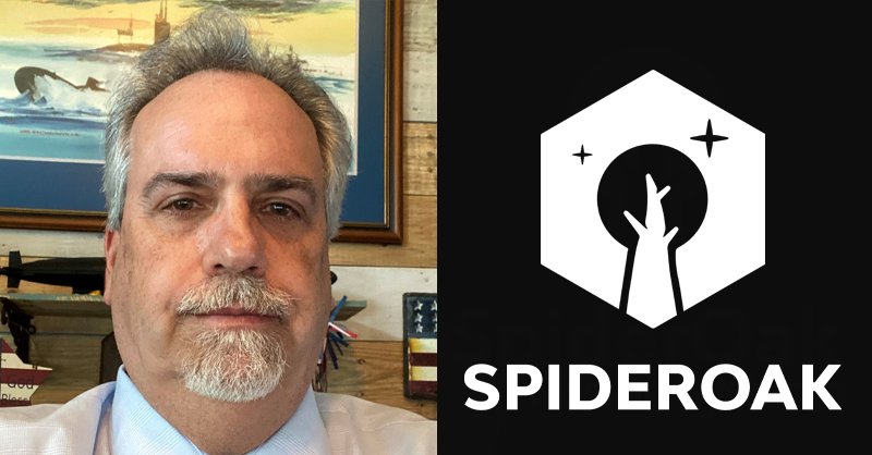 a man in a white shirt and tie next to a spideroak logo